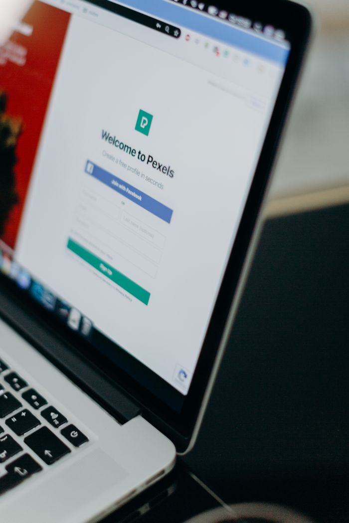 hero-about Focused shot of a laptop displaying the Pexels login page, highlighting modern digital interface.